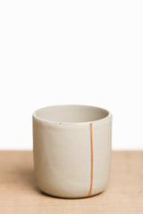White ceramic cup with line
