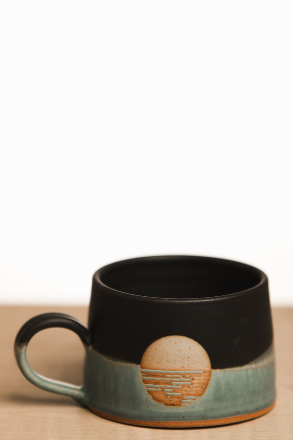 Black and turquoise sunset ceramic mug