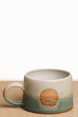 White and turquoise sunrise ceramic mug