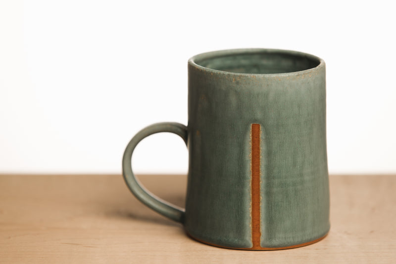 Turquoise ceramic mug with line