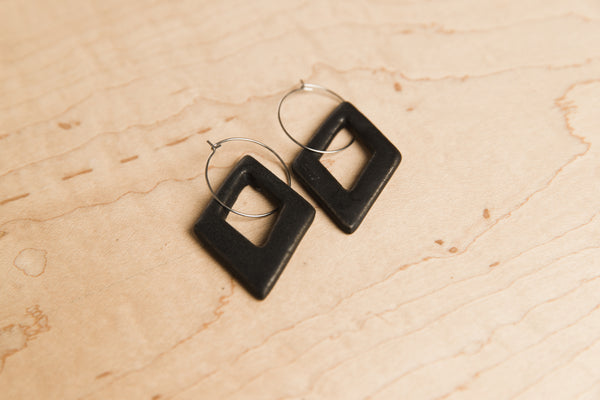 Diamond-shaped black ceramic dangle earrings
