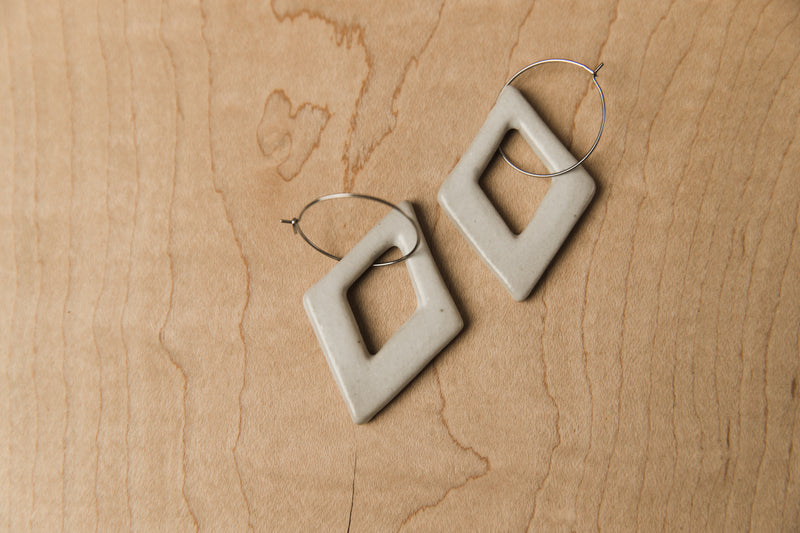 Diamond-shaped white ceramic dangle earrings