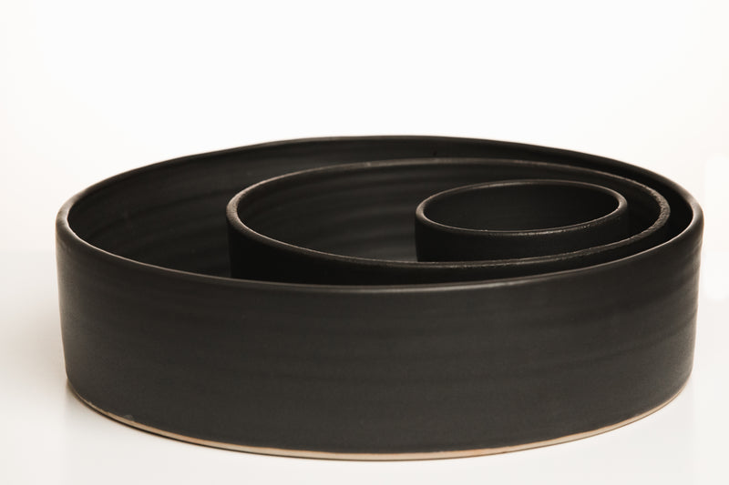 Medium black bowl with large black cylinder bowl and black appetizer bowl